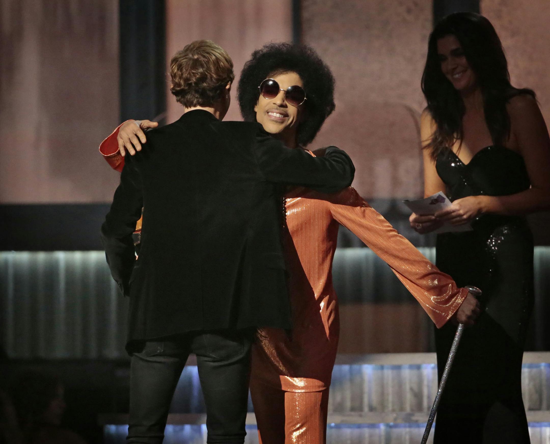 Prince congratulates Beck for his Grammy win for Best Album of the Year at the 57th Annual Grammy Awards at Staples Center in Los Angeles on Sunday, Feb. 8, 2015. (Robert Gauthier/Los Angeles Times/TNS) ORG XMIT: 1163707
