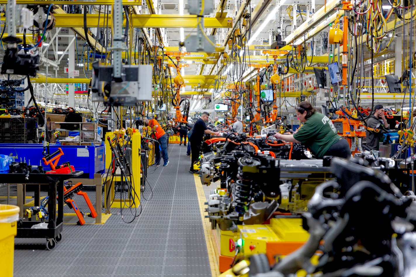 FILE Ñ An assembly area for the Ford F-150 Lightning, an electric pickup, in Dearborn, Mich., April 4, 2022. A battle between Detroit carmakers and the UAW, which escalated on Friday, Sept. 15, with targeted strikes in three locations, is about pay, and also about workers trying to defend jobs as manufacturing shifts to electric vehicles Ñ which have fewer parts. (Sylvia Jarrus/The New York Times)