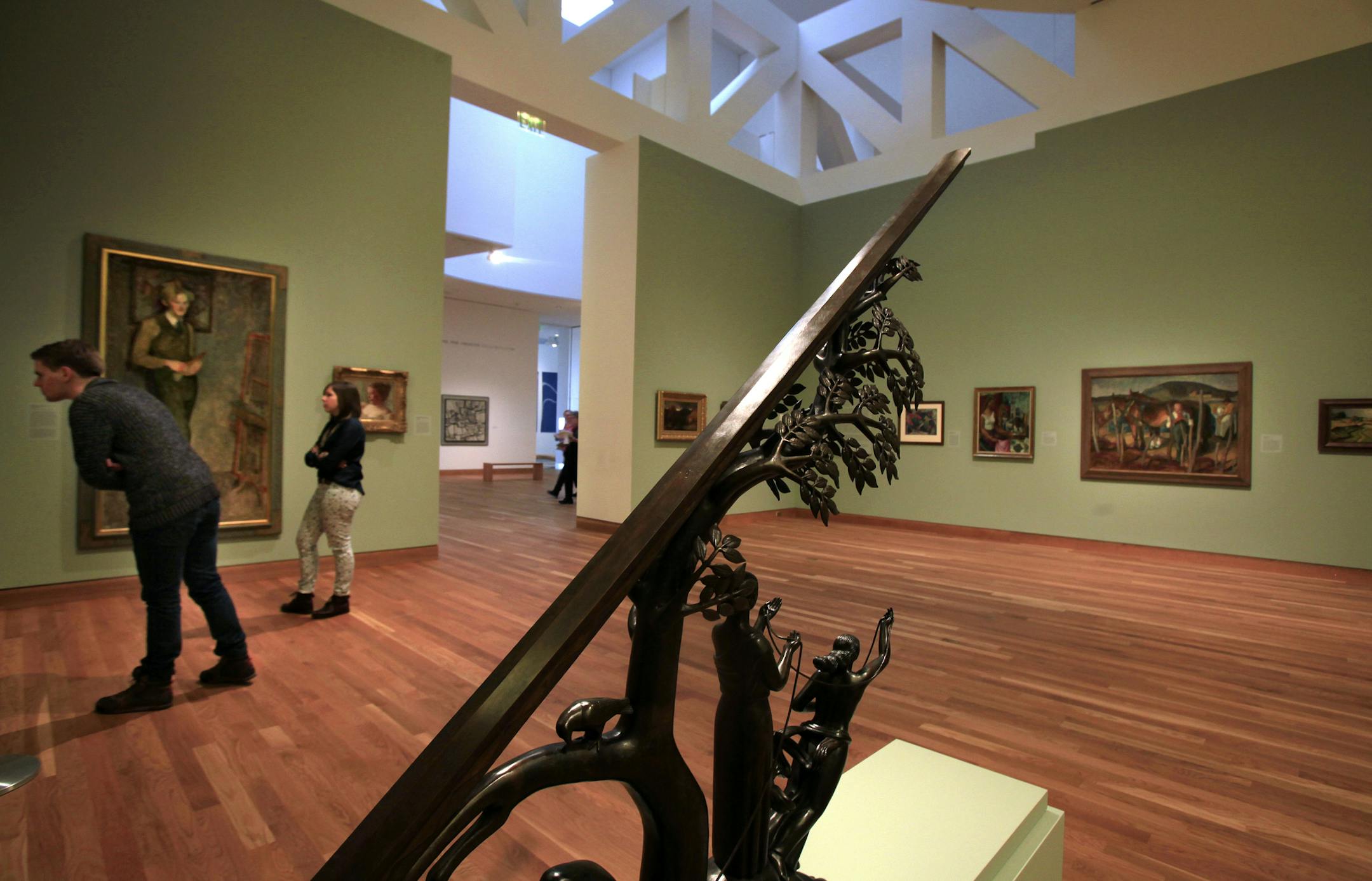 Rachel Kimpton of Dallas, Texas (left) and Cole Spiess of Anoka, Mn look over the art at the Weisman Art Museum. Mn Museum of American Art's collection at the Weisman Art Museum, 333 E. River Rd., Mpls, MN on February 6, 2013. Art from Left to right: Dewey Albinson, 1922 by Frances Cranmer Greenman. The Pearl Nacklace (Portrait of a Lady) by Fredrick Childe Hassam. Time and the Fates Sundial, 1938 by Paul Manship (foreground) ] JOELKOYAMA•joel.koyama@startribune.com With prime parts of th
