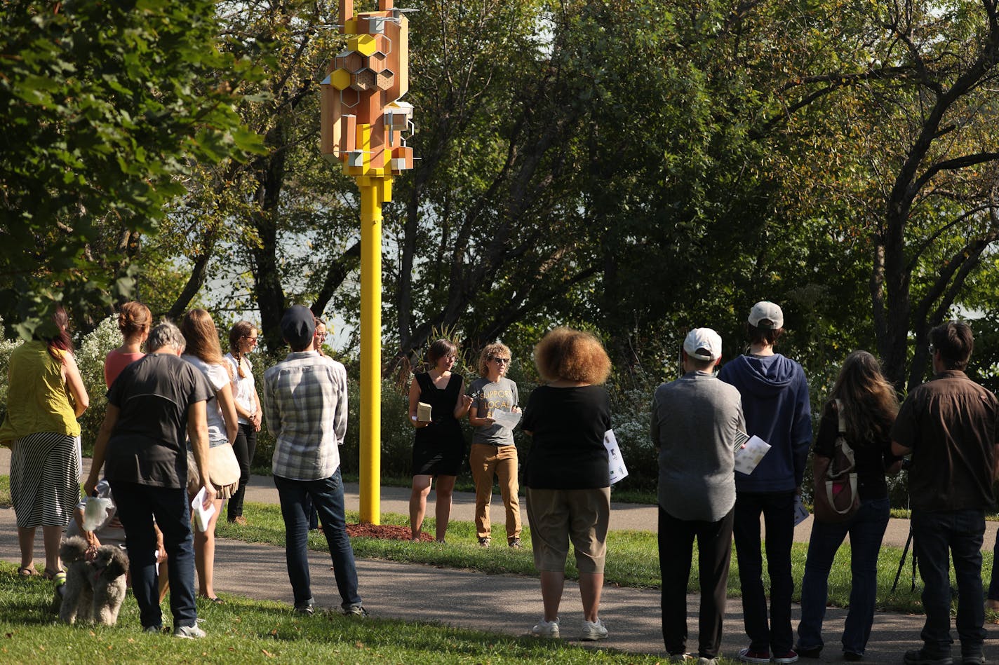 Artists Julie Benda and Amanda Lovelee spoke during the unveiling the city's first bee "Sky-Rise" habitat. ] ANTHONY SOUFFLE &#xef; anthony.souffle@startribune.com Public Art St. Paul held a event to unveil the city's first bee "Sky-Rise" habitat Wednesday, Sept. 13, 2017 near Como Park in St. Paul, Minn. The high rise home for pollinators was designed to not only provide bee habitat, but to allow researchers to study how wild bees use man-made structures.