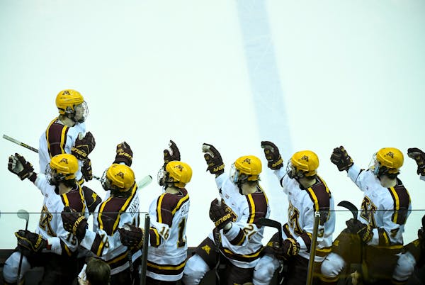 Gophers forward Rem Pitlick (15), top right, celebrated with teammates after his first-period goal against Michigan earlier this month.