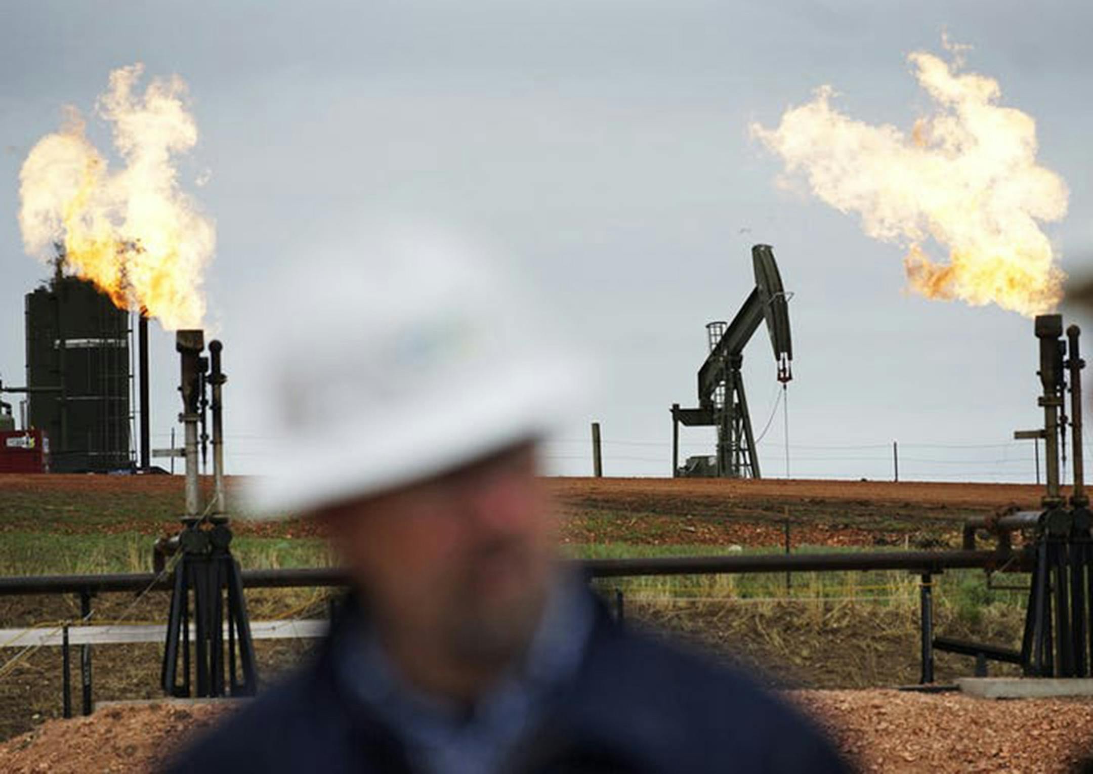 Both oil and natural gas production hit a record in October in North Dakota. (Richard Tsong-Taatarii/Star Tribune)