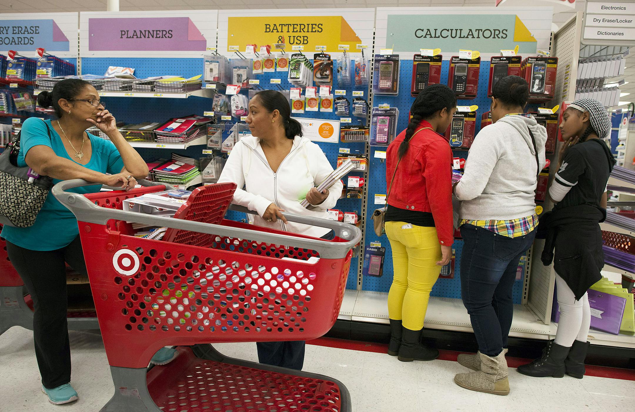 Customers shop for back to school supplies at a Target Corp. store in Colma, California, U.S., on Saturday, Aug. 9, 2014. Retailers are pushing for a longer shopping season and earlier than ever deals on order to get customers to buy more over a longer period of time, says DealNews spokesman Mark LoCastro, which tracks price and discount trends across the web, according to USA Today. Photographer: David Paul Morris/Bloomberg ORG XMIT: 506646325