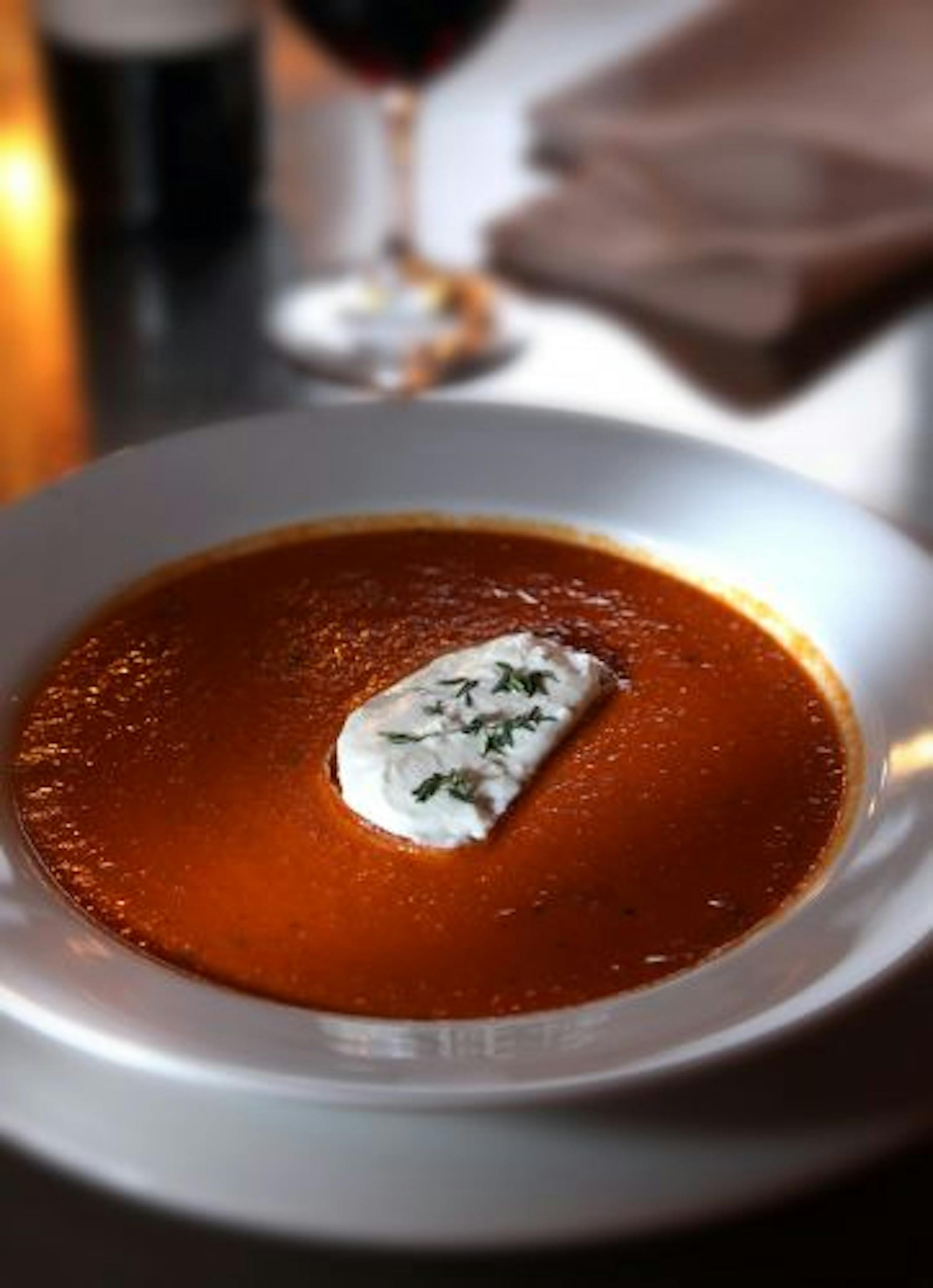 Tomato soup, garnished with chèvre and fresh thyme, is one of many remarkable soups.
