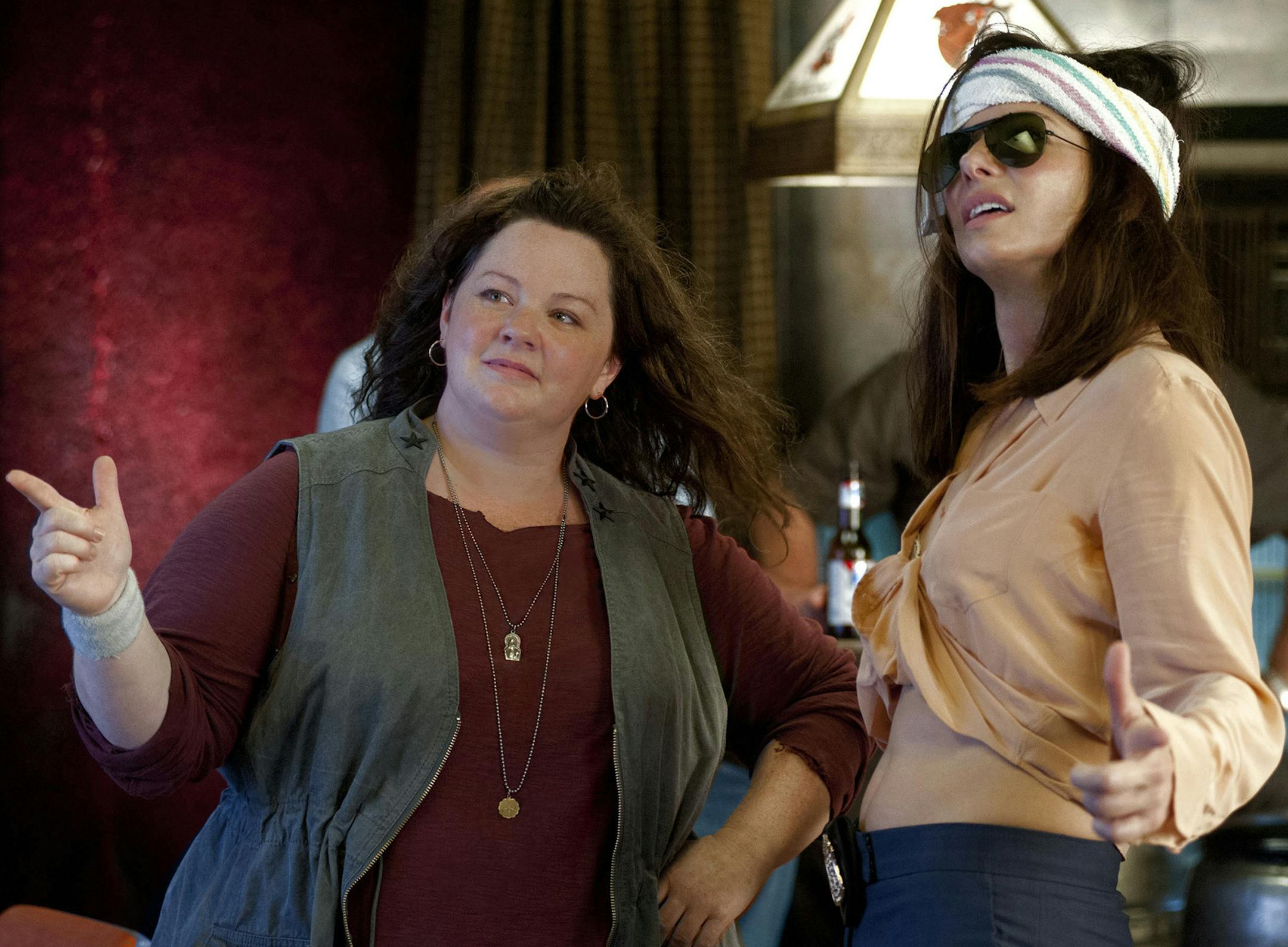 This film publicity image released by 20th Century Fox shows Sandra Bullock as FBI Special Agent Sarah Ashburn, right, and Melissa McCarthy as Boston Detective Shannon Mullins in a scene from "The Heat." (AP Photo/20th Century Fox, Gemma La Mana) ORG XMIT: MIN2013062613464185