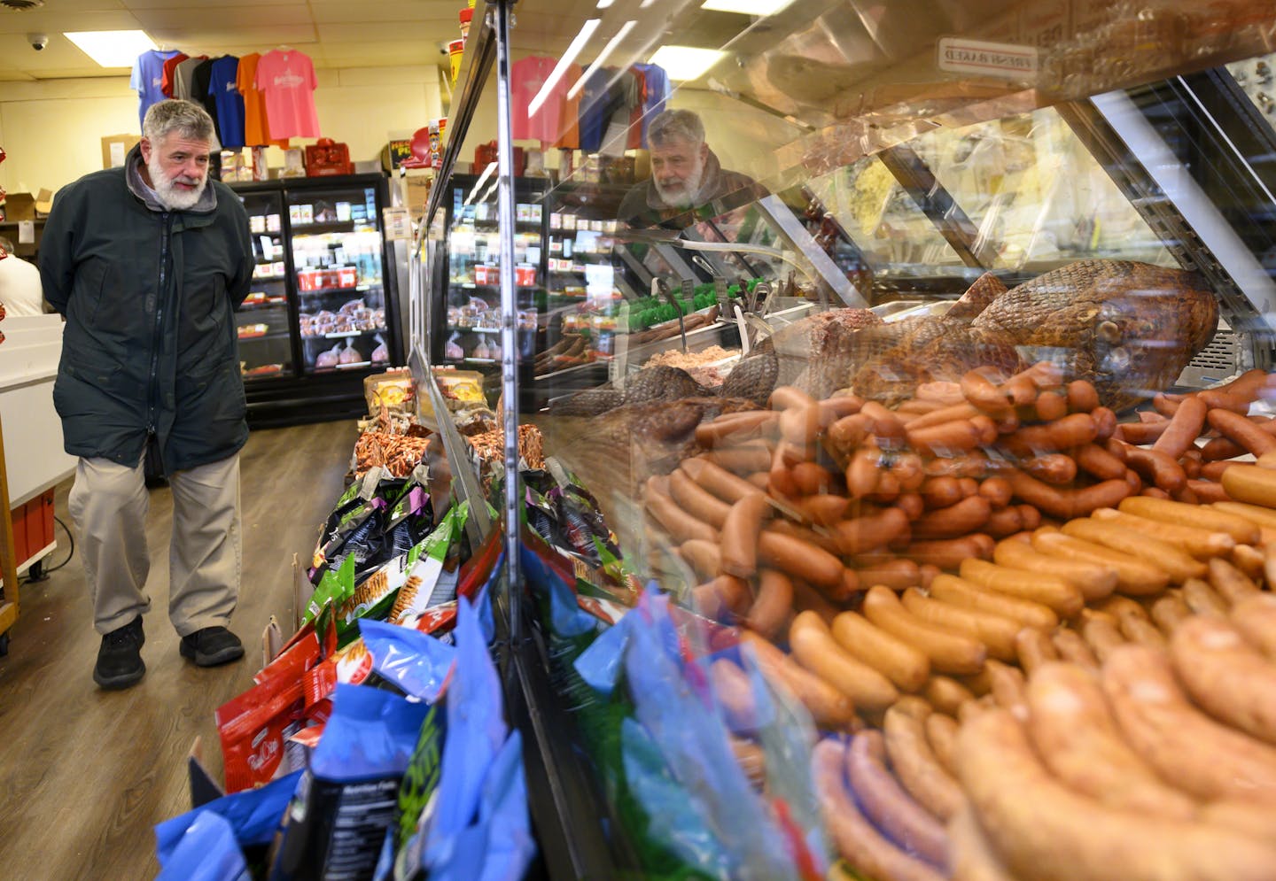 Bruce Center, of North Minneapolis, checked out the selection at Hackenmueller's Meat Market in Robbinsdale Friday afternoon. Center has been shopping at Hackenmueller's for three decades and has seen the change in the area. "The places in Robbinsdale I've always counted on; Hackenmueller's, Ace Hardware, Sipe's Auto Repair, they haven&#x2019;t gone anywhere," said Center. "It became trendy. I've got no objection at all."
] Aaron Lavinsky &#x2022; aaron.lavinsky@startribune.com A strip of Broadw