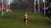 With no other runner visible, Forest Lake junior Norah Hushagen (232) pulls far ahead of the pack as she finishes the home stretch to win the Class 3A