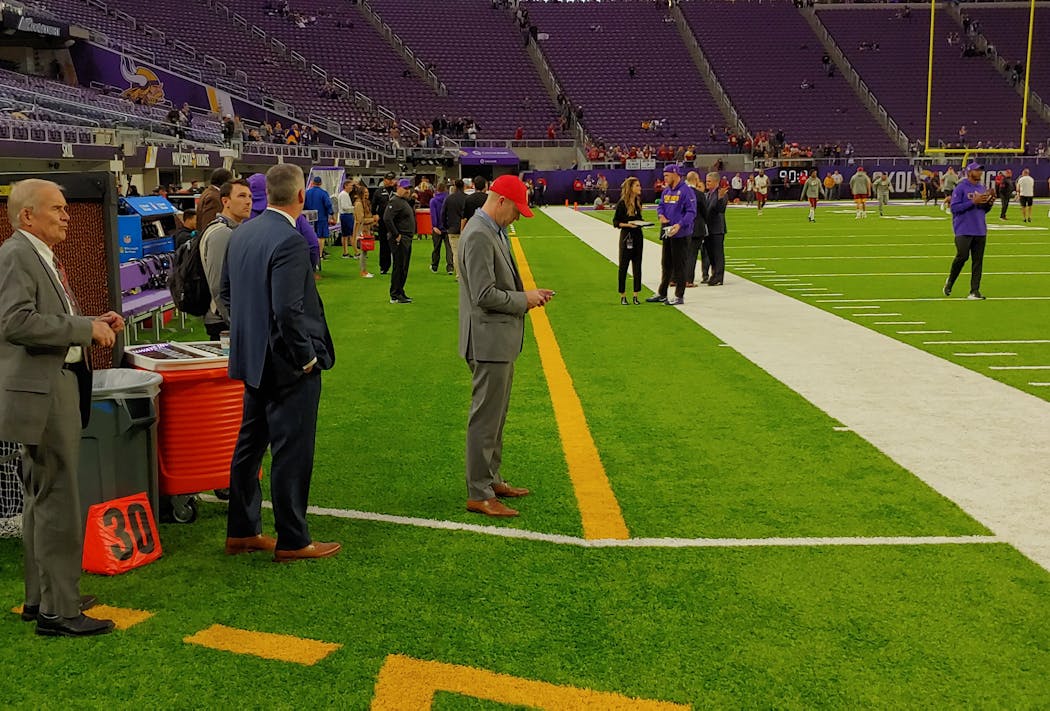 This pre-game photo shows the yellow stripes and dotted lines that help define the area that players and coaches are supposed to remain inside on the sidelines at U.S. Bank Stadium. 