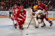 The Gophers’ Connor Kurth (10) battled for the puck in Minnesota’s home loss to Wisconsin on Oct. 27. The Badgers swept the Gophers that weekend.