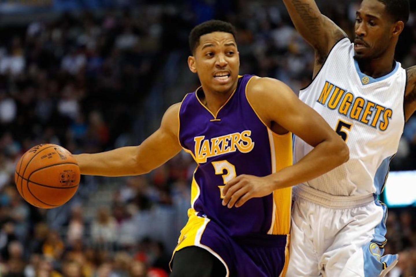 DENVER, CO - MARCH 02:  Anthony Brown #3 of the Los Angeles Lakers controls the ball against Will Barton #5 of the Denver Nuggets at Pepsi Center on March 2, 2016 in Denver, Colorado. The Nuggets defeated the Lakers 117-107. NOTE TO USER: User expressly acknowledges and agrees that, by downloading and or using this photograph, User is consenting to the terms and conditions of the Getty Images License Agreement.  (Photo by Doug Pensinger/Getty Images)