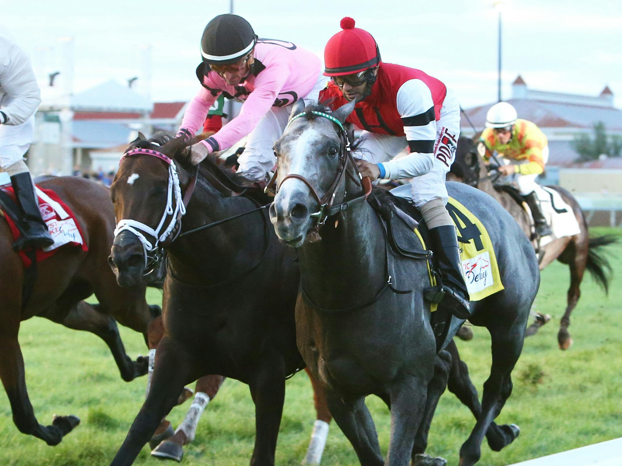 #4 One Mean Man ridden by Orlando Mojica winning the Mystic Lake Derby on Saturday, Aug. 27, 2016 at Canterbury Park. The horse to his outside is second-place finisher Whatawonderflworld ridden by Robby Albarado. (Coady Photography)