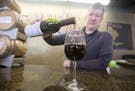 Mark Hedin pours a glass of Minnesota grape wine Marquette, one of Two Rivers Vineyard & Winery's most popular wines. ] BRIDGET BENNETT SPECIAL TO THE