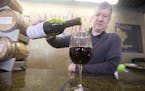 Mark Hedin pours a glass of Minnesota grape wine Marquette, one of Two Rivers Vineyard & Winery's most popular wines. ] BRIDGET BENNETT SPECIAL TO THE