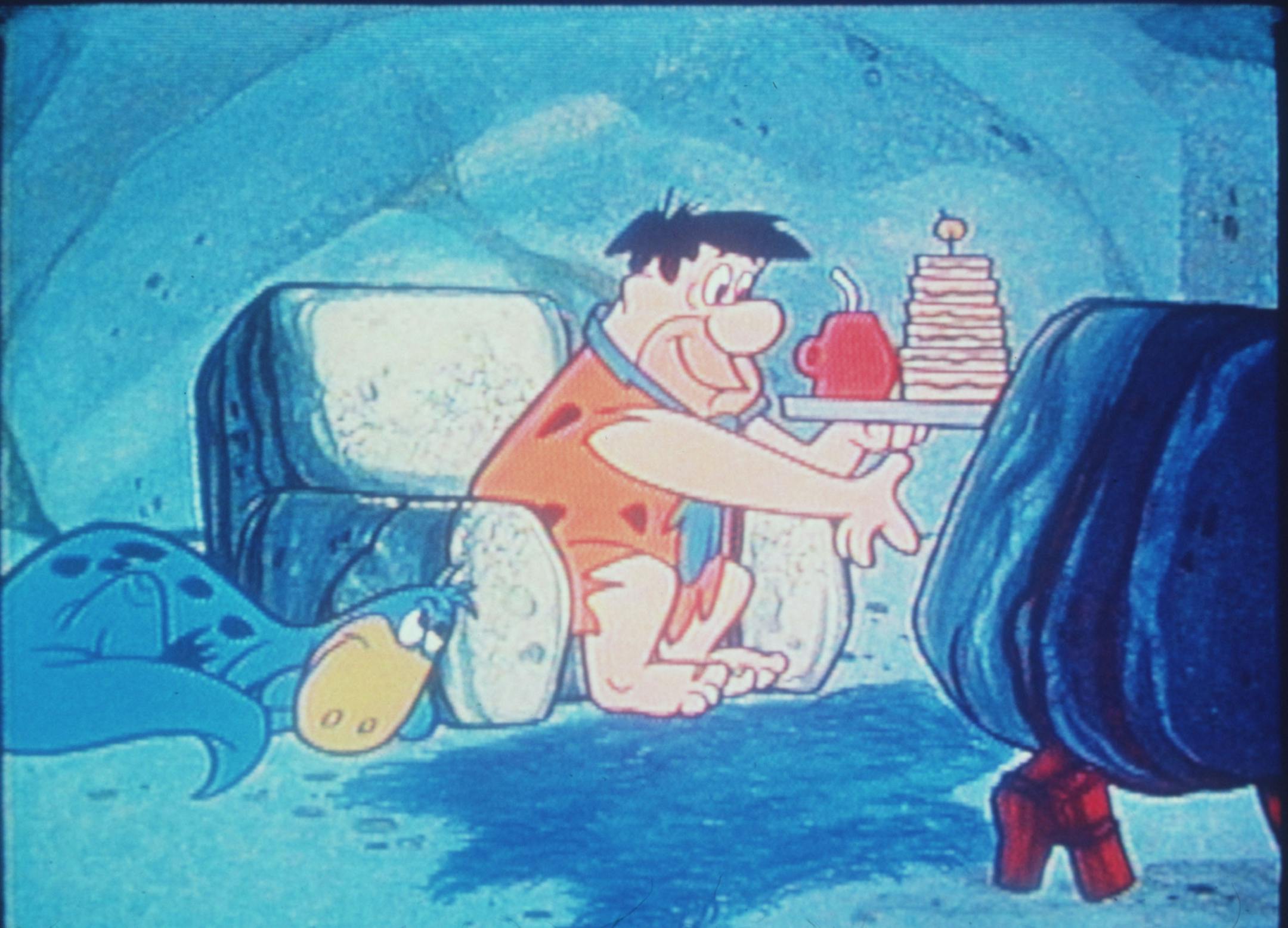 Fred Flintstone, main character on "The Flintstones" cartoon tv show (1960-66).