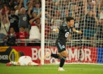 Loons forward Sang Bin Jeong celebrates a penalty shot goal vs. Toluca goalkeeper Tiago Volpi in a 2023 Leagues Cup match at Allianz Field.