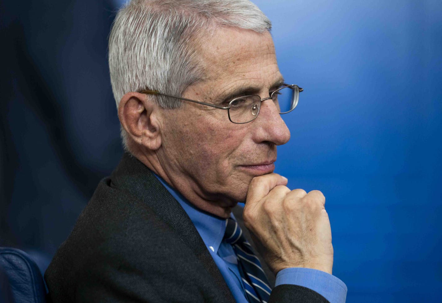 FILE -- Dr. Anthony Fauci looks on as President Donald Trump held a daily coronavirus briefing at the White House in Washington, April 6, 2020. As the pandemic worsened, Fauci's darker view of the circumstances was countered within the White House by the reassurances ostensibly offered by Dr. Deborah Birx's data. (Doug Mills/The New York Times) ORG XMIT: XNYT50