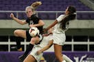 Lakeville North High School defender Molly Waters (17) leapt atop Maple Grove High School Shelby Handberg (10) to clear the ball as Maple Grove High S