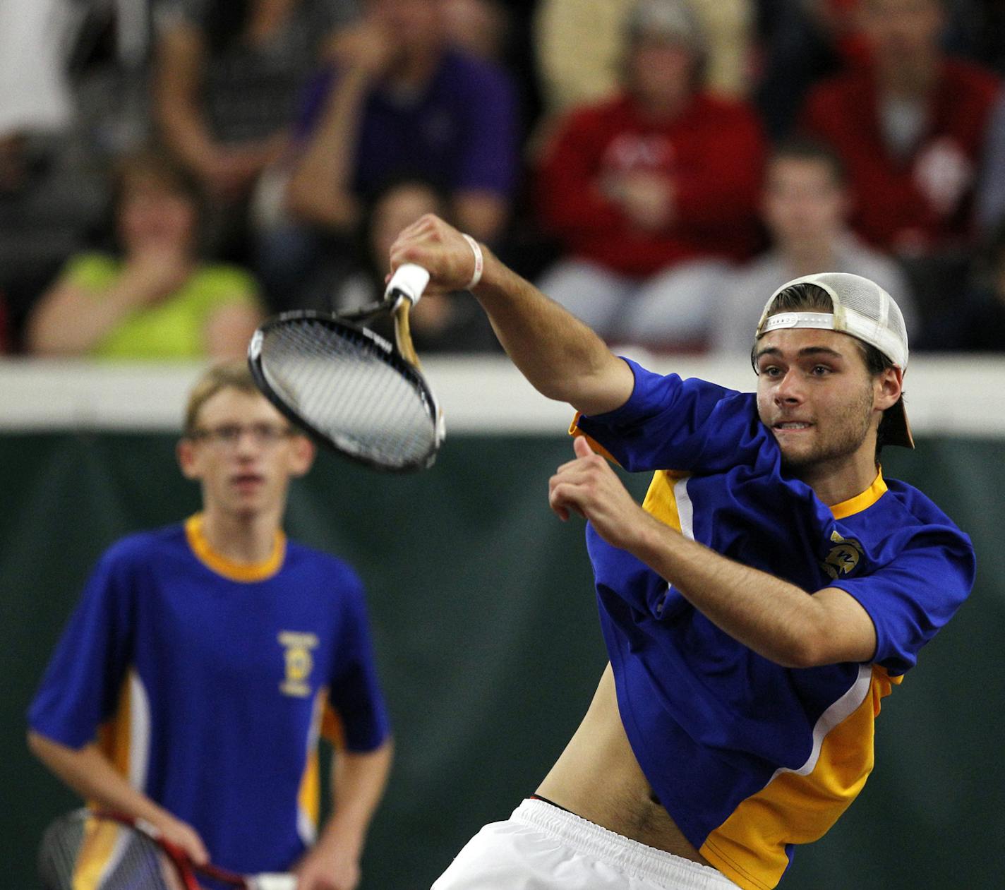 Jack Graven of Wayzata hits an overhead shot as his doubles partner Nicholas Beaty watches during the Class 2A doubles tennis final against St. Paul Highland Park at the University of Minnesota's Baseline Tennis Center, Friday, June 7, 2013 in Minneapolis. (Genevieve Ross/Special to the Star Tribune) ORG XMIT: 05PREP060813.tennis