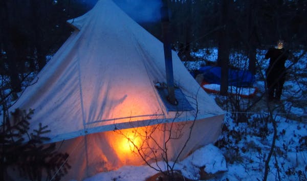 The camp stove glowed inside this tent, where the author prepared a hot supper of venison, beans in bourbon sauce and a simple flat bread called banno