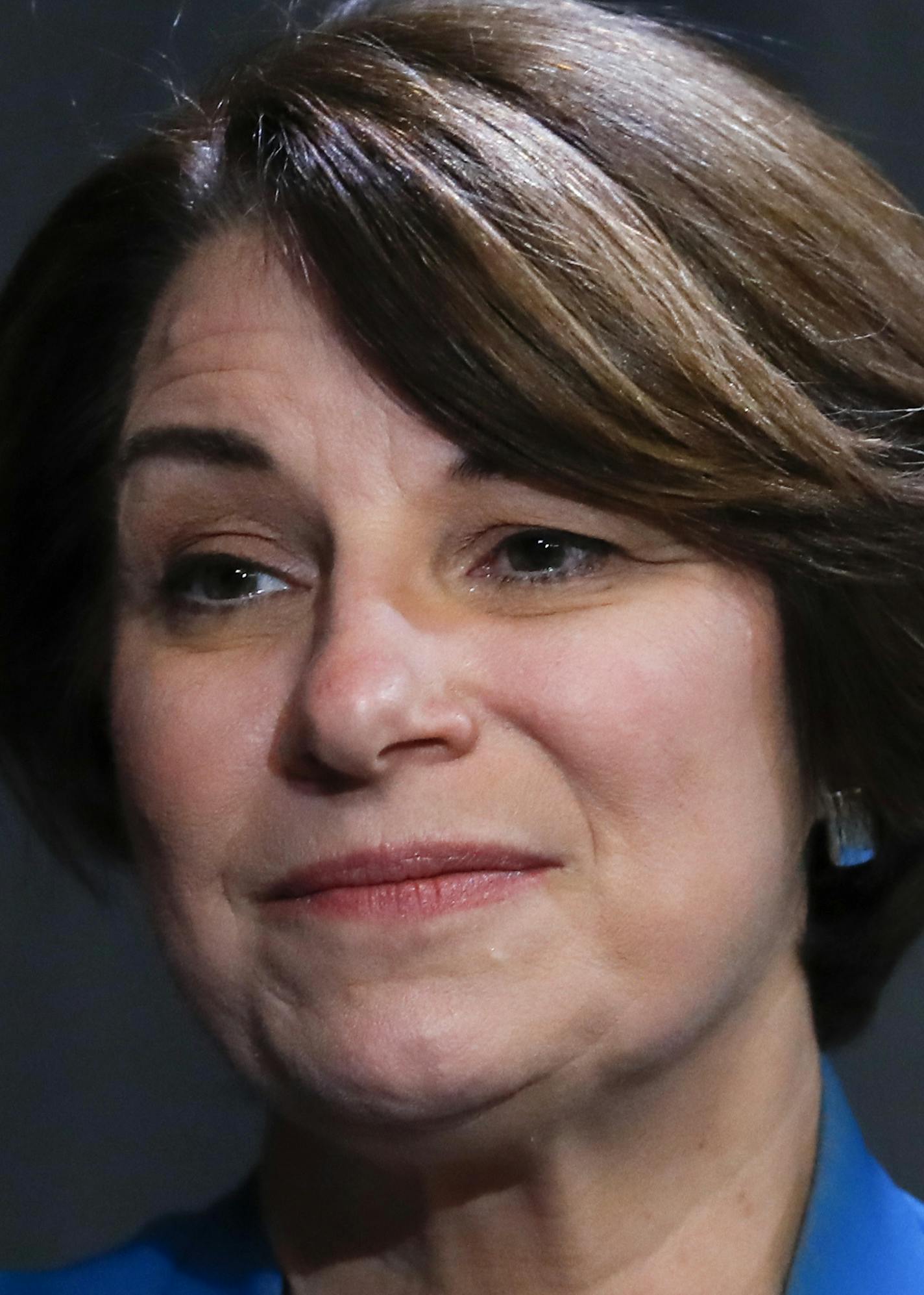 Democratic presidential candidate Sen. Amy Klobuchar, D-Minn., listens to a question during an interview before speaking at the National Organization of Black County Officials annual Economic Development Conference in Detroit, Friday, May 3, 2019. (AP Photo/Paul Sancya)