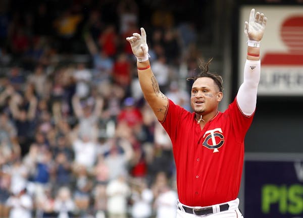 Minnesota Twins' Oswaldo Arcia celebrates after driving in the winning run against the Los Angeles Angels in the 12th inning of a baseball game Sunday