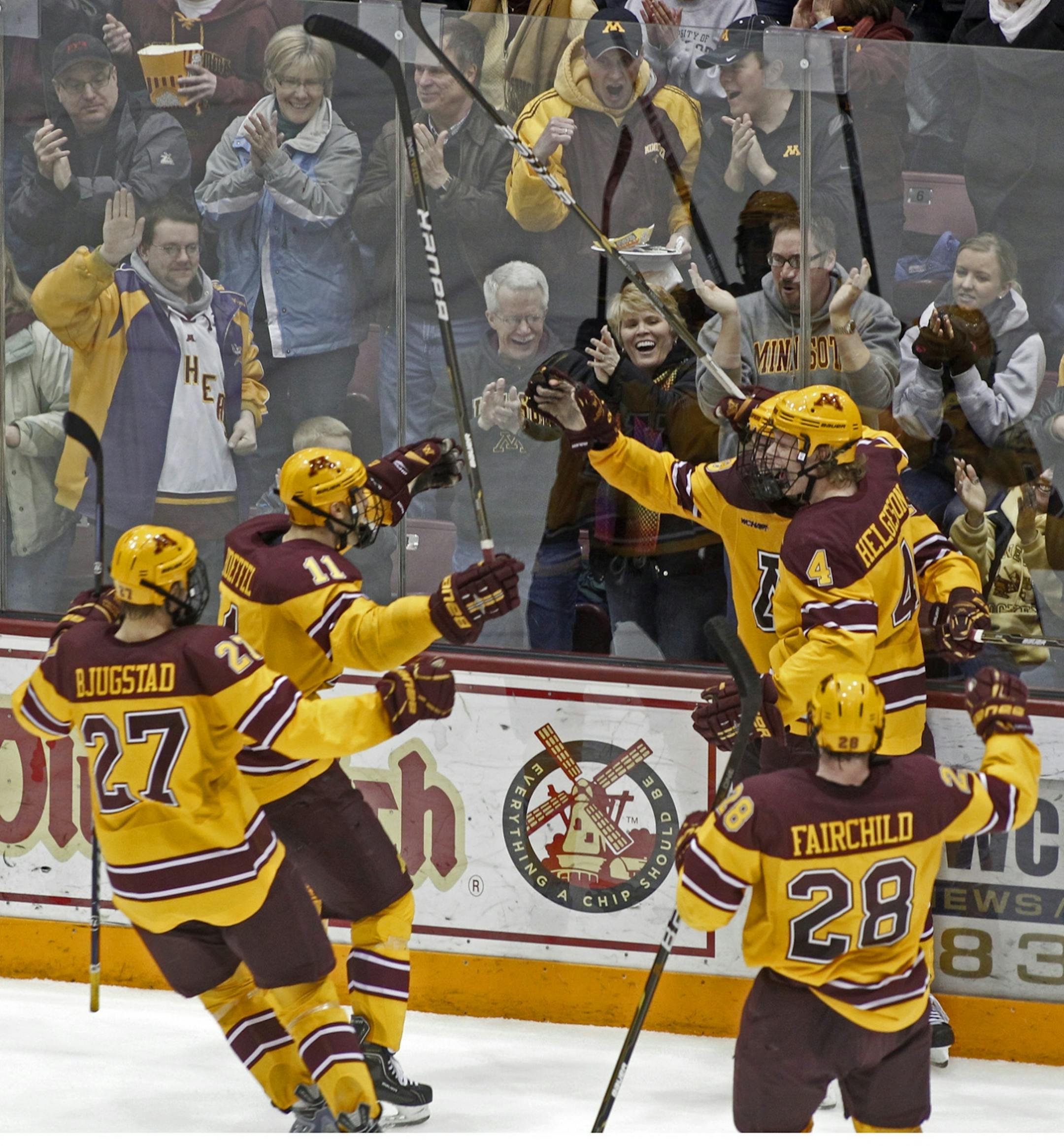 Nick Larson was congratulated by teammates after scoring a goal in the second period Friday night against Michigan Tech.