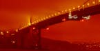 In this photo provided by Frederic Larson, the Golden Gate Bridge is seen at 11 a.m. PT, Wednesday, Sept. 9, 2020, in San Francisco, amid a smoky, ora