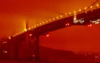In this photo provided by Frederic Larson, the Golden Gate Bridge is seen at 11 a.m. PT, Wednesday, Sept. 9, 2020, in San Francisco, amid a smoky, ora