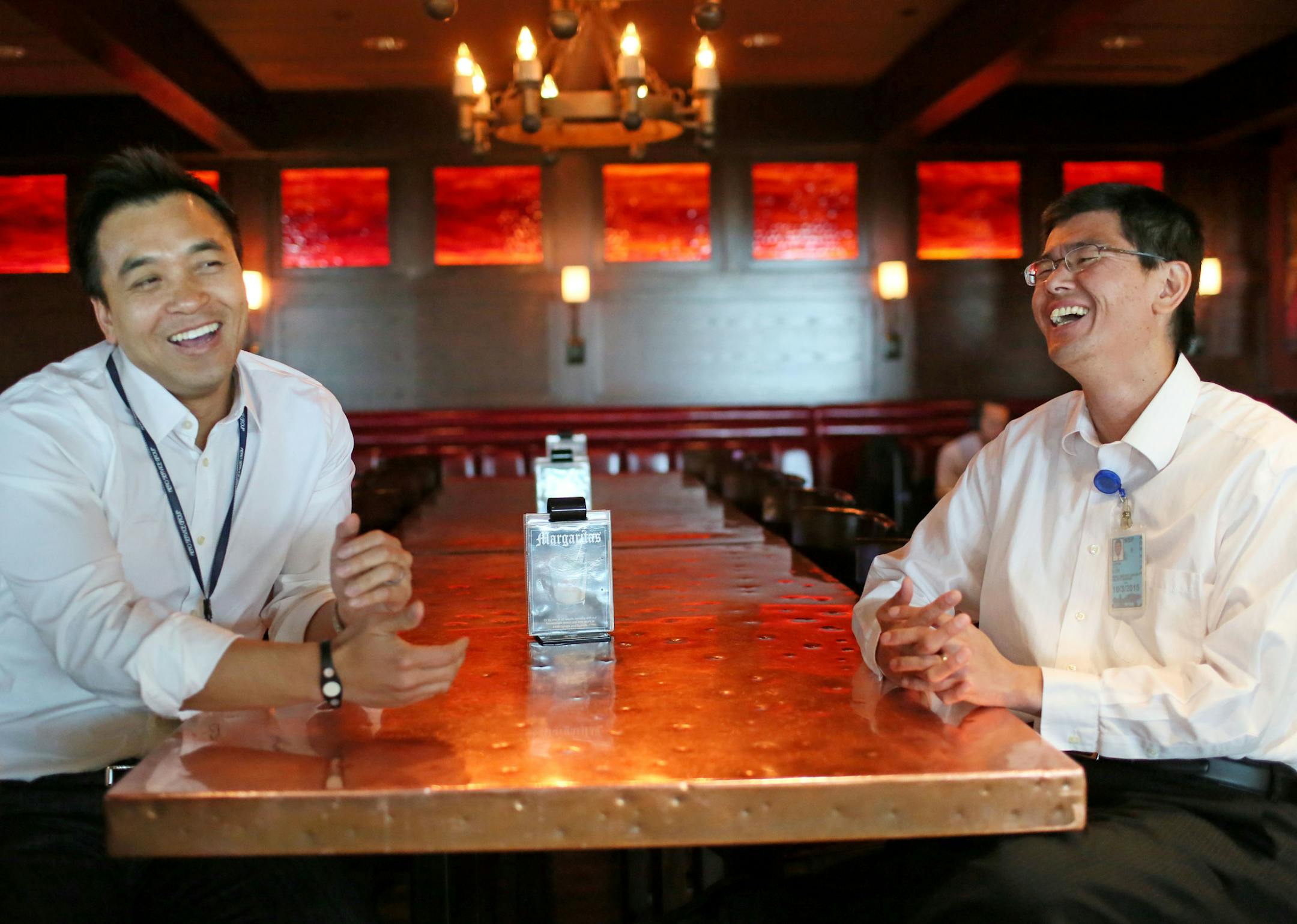 Cheng Lor, right, and his family fled the killing fields of Cambodia; Binh Le's family escaped South Vietnam as Saigon fell. The now friends and business partners were seen at their Cocina Del Barrio venture at the Humphrey Terminal at MSP Wednesday, April 22, 2015 in Minneapolis, MN.](DAVID JOLES/STARTRIBUNE)djoles@startribune.com Cheng Lor and his family fled the killing fields of Cambodia; Binh Le's family escaped South Vietnam as Saigon fell. The two men started a business running airport re