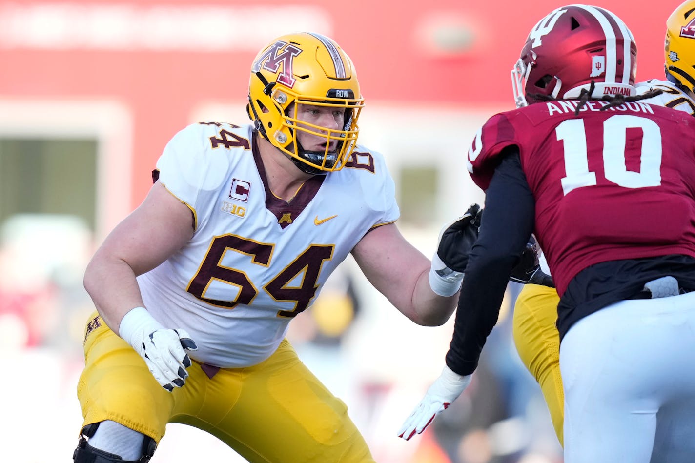 Minnesota offensive lineman Conner Olson (64) defends against Indiana defensive lineman Ryder Anderson (10) in the first half during an NCAA college football game in Bloomington, Ind., Saturday, Nov. 20, 2021. (AP Photo/AJ Mast)