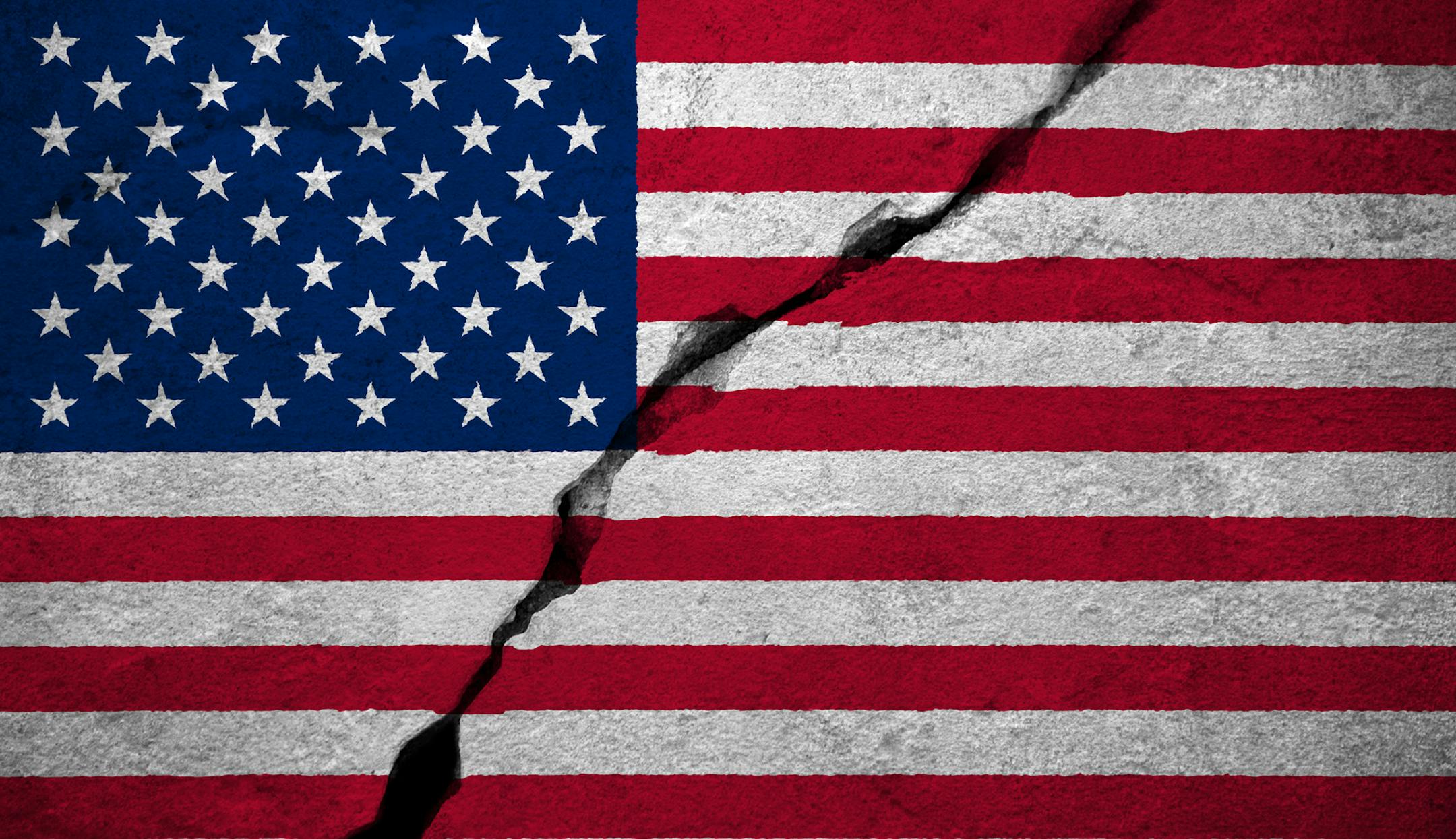 Flag of the United States of America painted onto a cracked wall