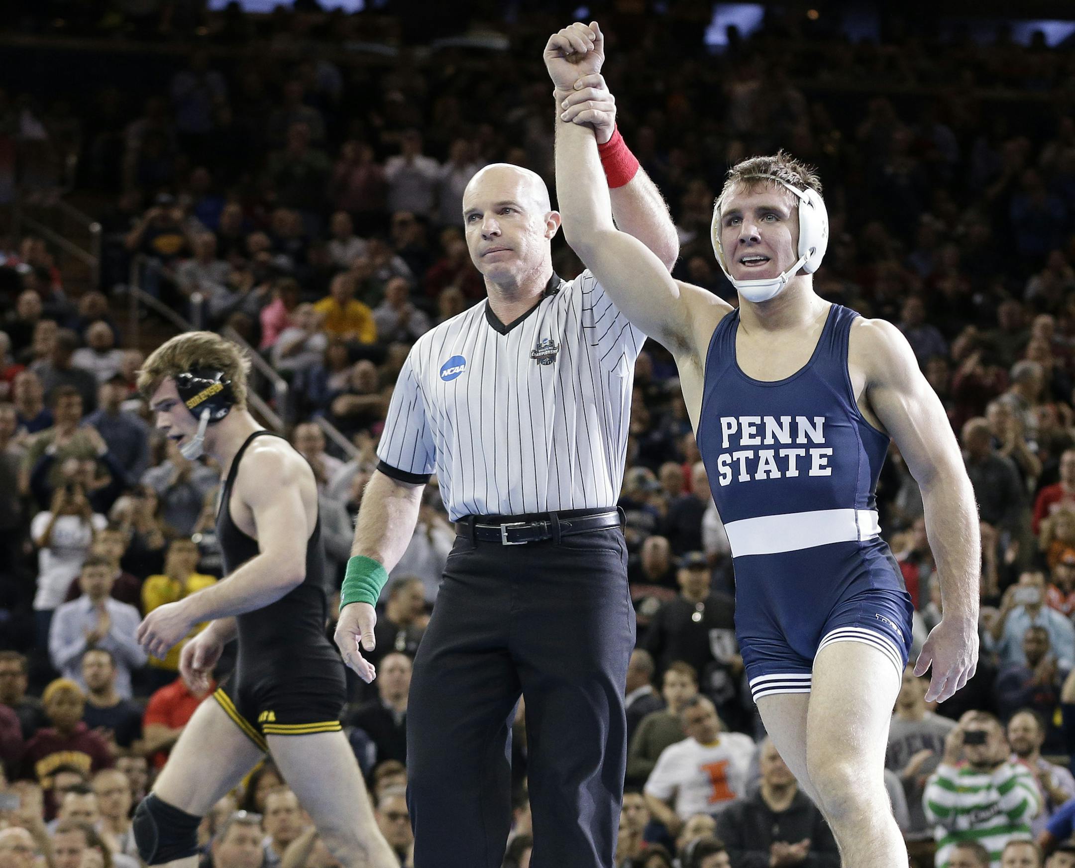 Penn State's Zain Retherford, is declared the winner over Iowa's Brandon Sorenson in the 149-pound championship match of the NCAA Division I Wrestling Championships, Saturday, March 19, 2016, in New York. (AP Photo/Julie Jacobson)