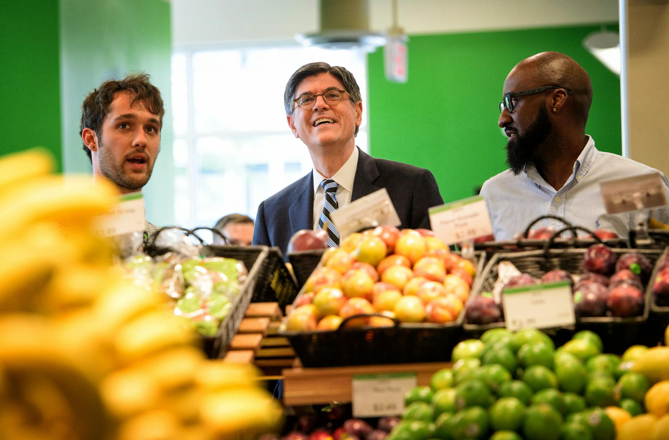 Jack Lew, center with Ray Williams, right, Seward Co-Op Store Manager and Alex Christensen, left, produce manager. Jack Lew, Obama's Treasury secretary, is in town to talk about the U.S. economy and the New Markets Tax Credit program, which helped fun the new Seward Co-Op Friendship Store on 38th Street. ] GLEN STUBBE * gstubbe@startribune.com Monday, August 8, 2016