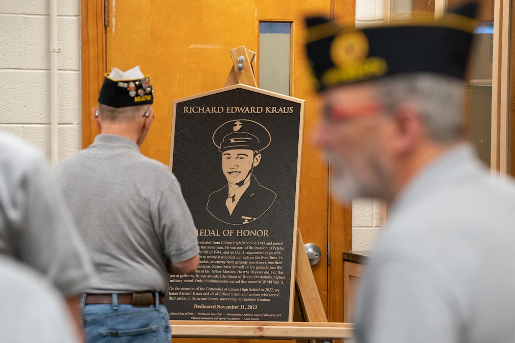 A new plaque honoring Richard Kraus, a Thomas Edison High School alumni and WWII veteran who received the Medal of Honor, was on display during a Veterans Day ceremony Friday, Nov. 11, 2022 at Edison High School in Minneapolis.
