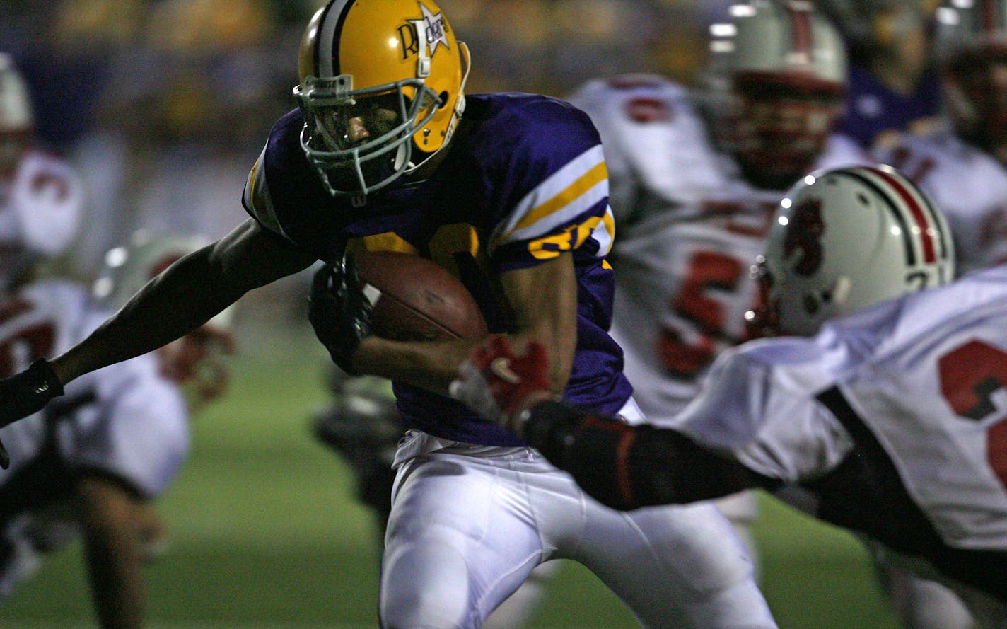 BRUCE BISPING ¥ bbisping@startribune.com St. Paul, MN, Friday, 9/21/2007. Cretin-Derham Hall vs. Stillwater. (left to right Cretin-Derham Hall's Mike Floyd ran through the Stillwater defense to score the second Raider touchdown in first half action.