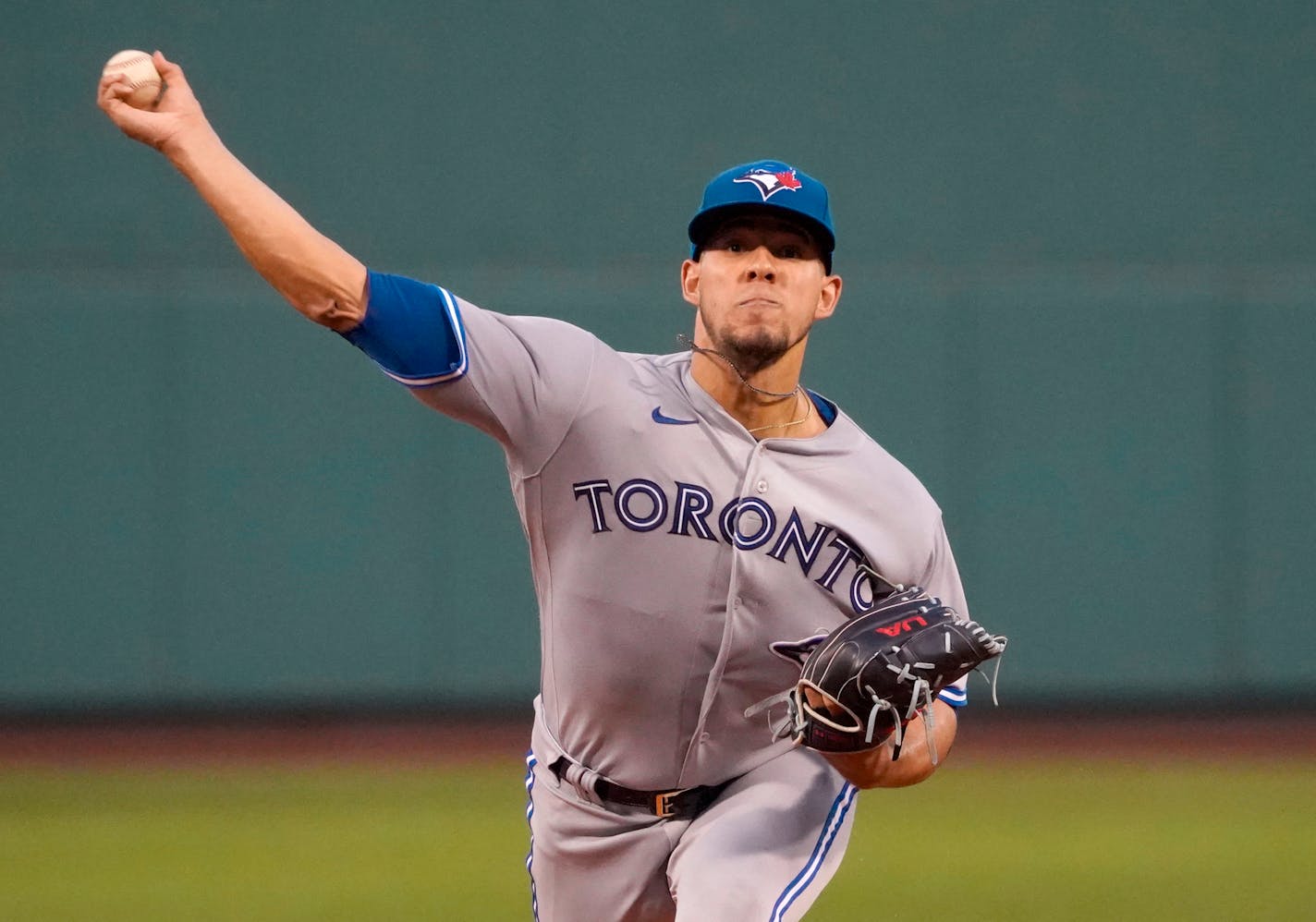 Toronto Blue Jays starting pitcher Jose Berrios delivers to a Boston Red Sox batter during the first inning of a baseball game at Fenway Park, Wednesday, Aug. 24, 2022, in Boston. (AP Photo/Mary Schwalm)