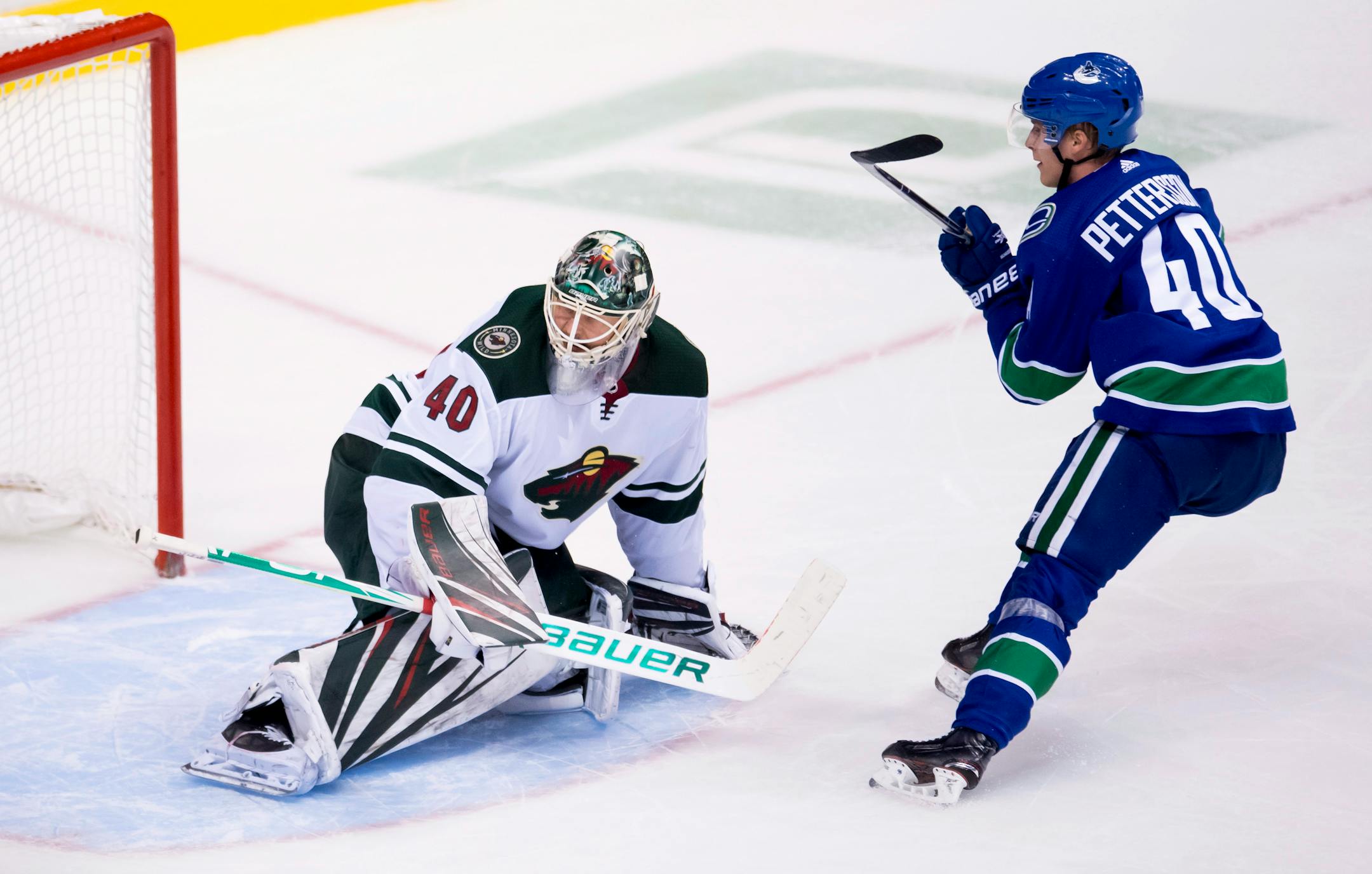Vancouver Canucks center Elias Pettersson sends a shot past Wild goaltender Devan Dubnyk in October.