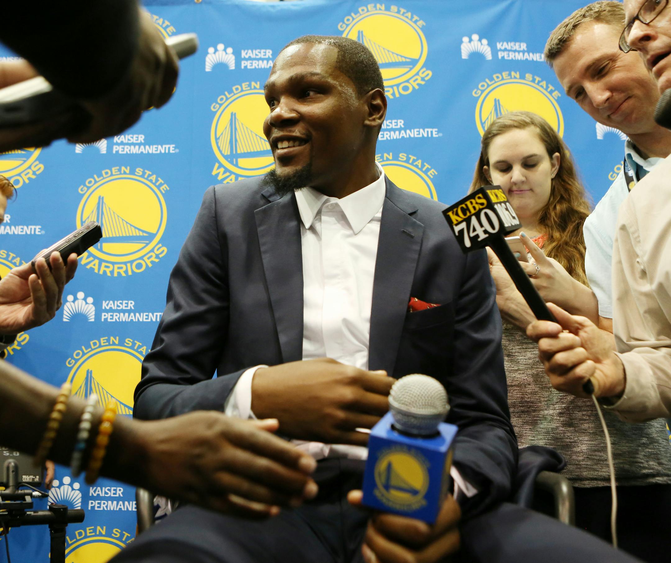 Golden State Warriors' Kevin Durant speaks with reporters after he was introduced during a news conference at the NBA basketball team's practice facility, Thursday, July 7, 2016, in Oakland, Calif. (AP Photo/Beck Diefenbach)