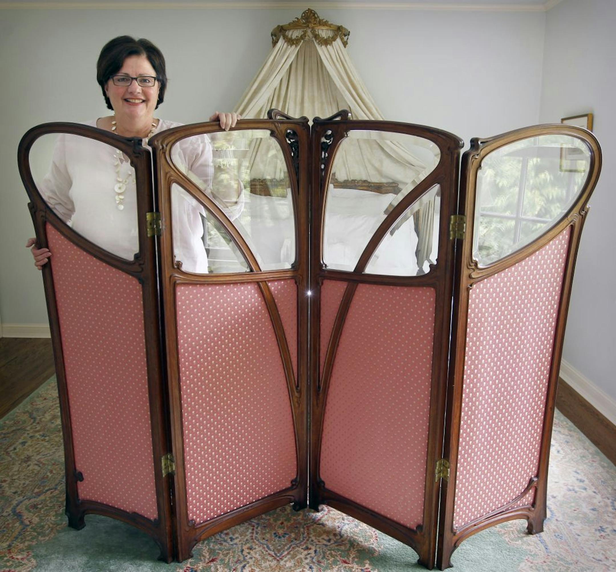 Lesley Ackerberg, with her large Art Nouveau screen covered in silk with crystal accents, which "Antiques Roadshow" is picking up for the taping of the show when it comes to Minneapolis.
TOM WALLACE � twallace@startribune.com __Assignments #20018599A_ June 30, 2011_ SLUG: roadshow0707_ EXTRA INFORMATION: Her screen, which might be from the House of Gerlain in Paris, circa late 1800s?