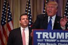 Gov. Chris Christie of New Jersey stands by after introducing Donald Trump as "the next president of the United States" in Palm Beach, Fla., March 1, 