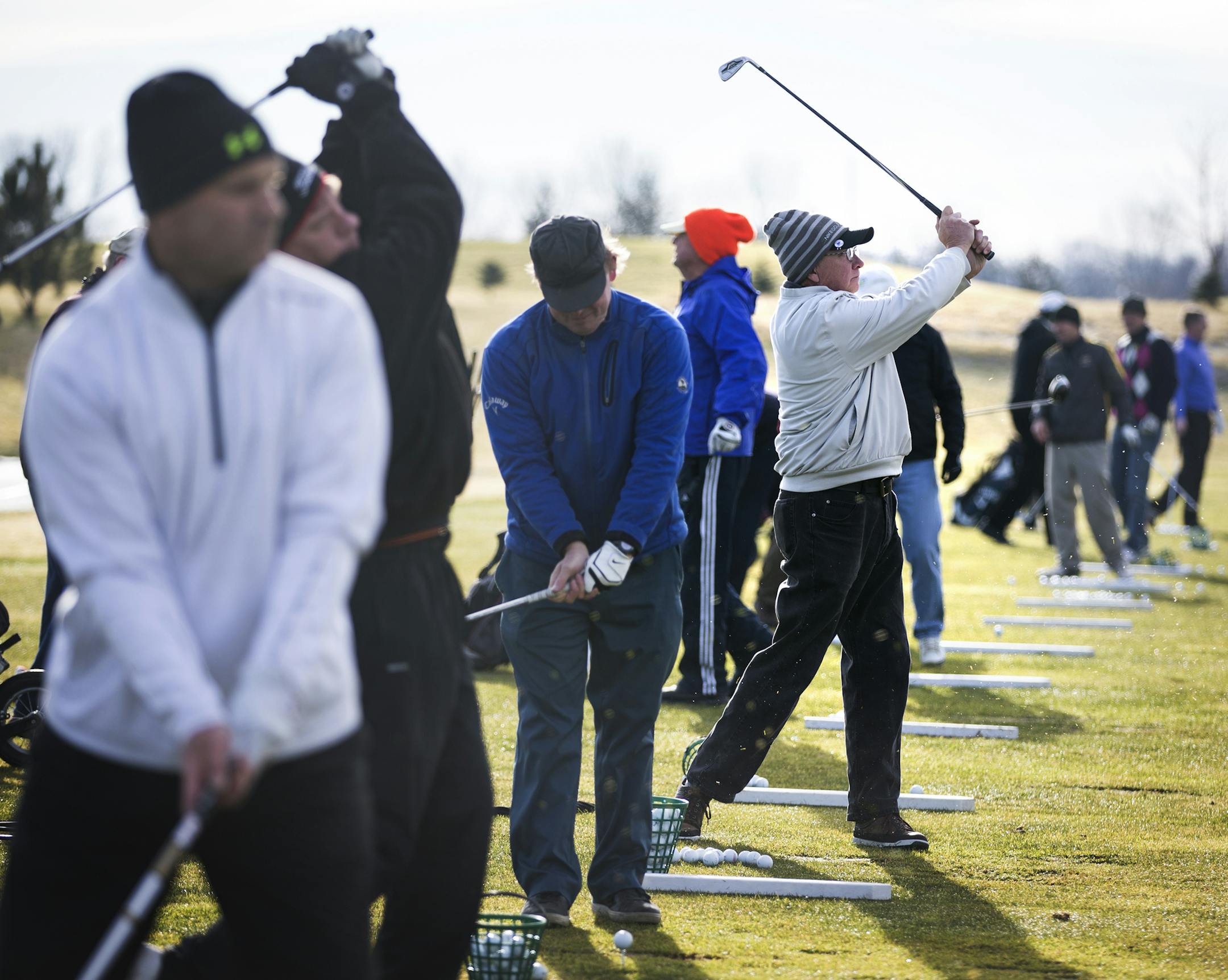 Golfers take shots at the driving range prior to tee time at Pioneer Creek Golf Course in Maple Plain on Wednesday, December 9, 2015. ] (Leila Navidi/Star Tribune) leila.navidi@startribune.com BACKGROUND INFORMATION: 122 golfers teed off during an 11a.m. shotgun tee time at Pioneer Creek Golf Course on Wednesday, with high temperatures in the mid-40s.