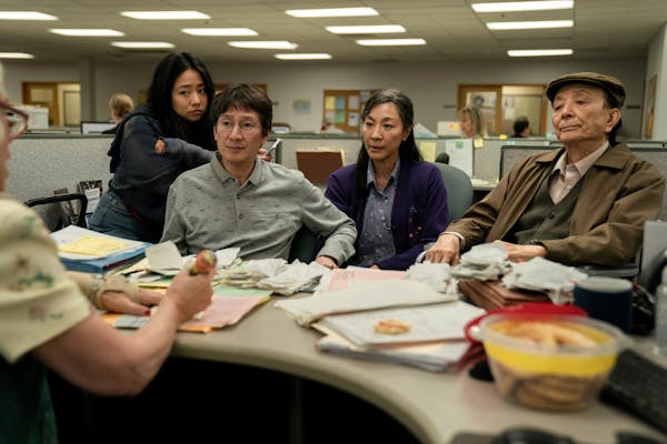 This image released by A24 Films shows, from left, Stephanie Hsu, Ke Huy Quan, Michelle Yeoh and James Hong in a scene from “Everything Everywhere A