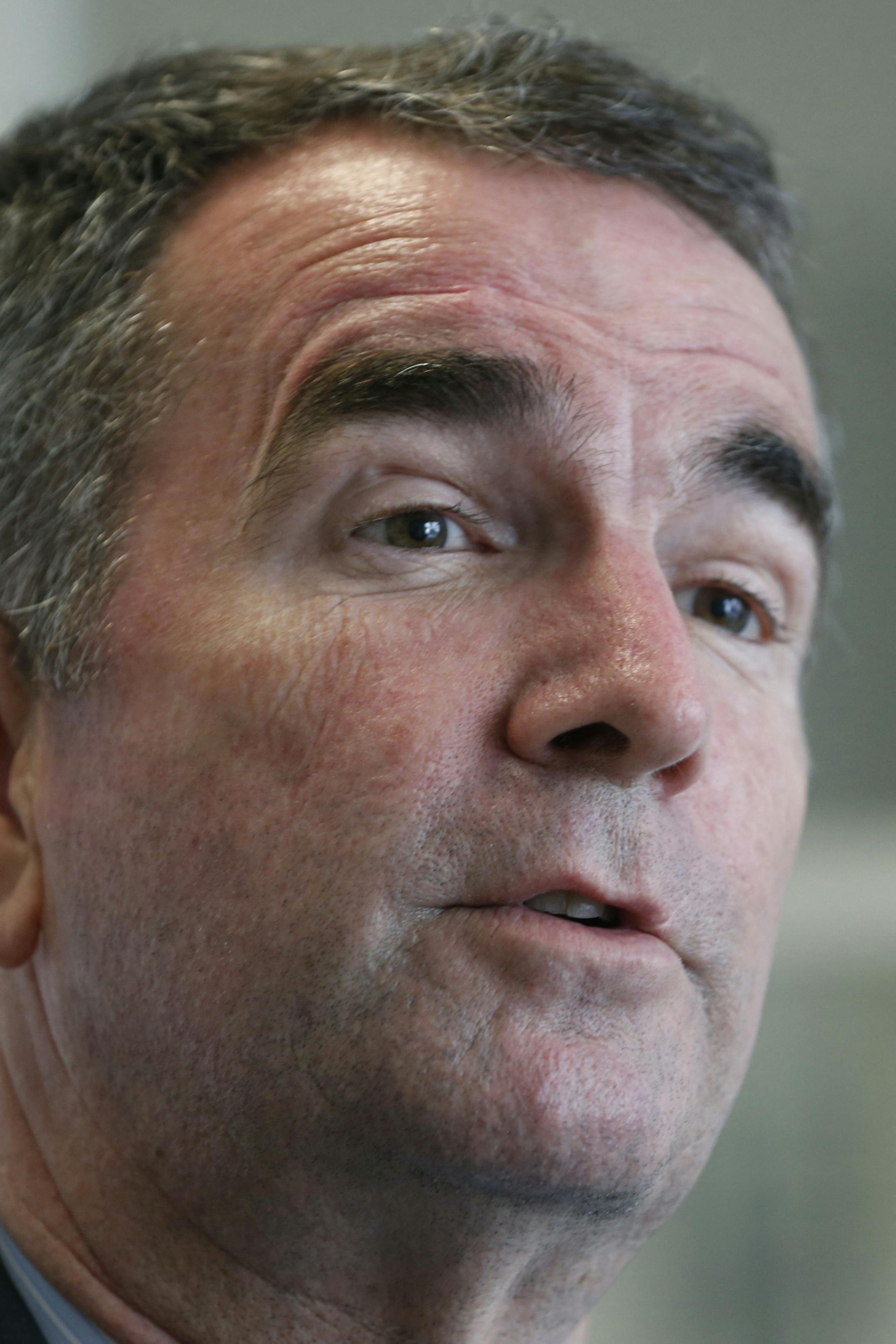 FILE - In this Sept. 18, 2017 file photo Democratic gubernatorial candidate, Lt. Gov. Ralph Northam pauses during an interview in Richmond, Va. President Donald Trump is giving his strongest endorsement to date of Republican Ed Gillespie in Virginia's closely watched race for governor. Gillespie is running against Northam. (AP Photo/Steve Helber, File)
