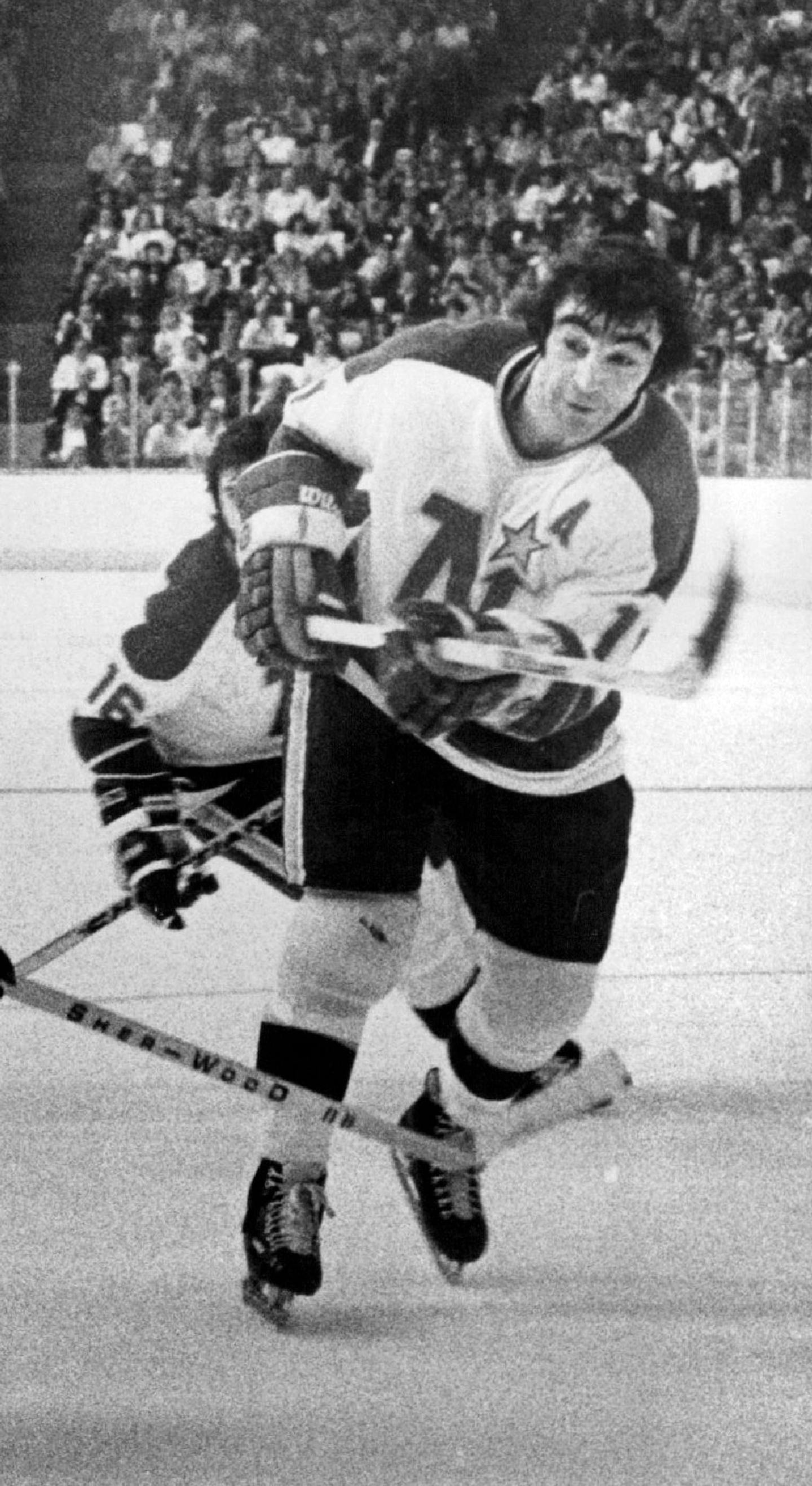 October 31, 1974 North Stars J.P. Parise, Right, scores Minnesota's Tying Goal With Boston bruins. Shoots puck (lower left) past Bruins Carol Vadnais in second period last night at Metropolitan Sports center Roger Nystrom, Minneapolis Star Tribune ORG XMIT: MIN2014092621503494