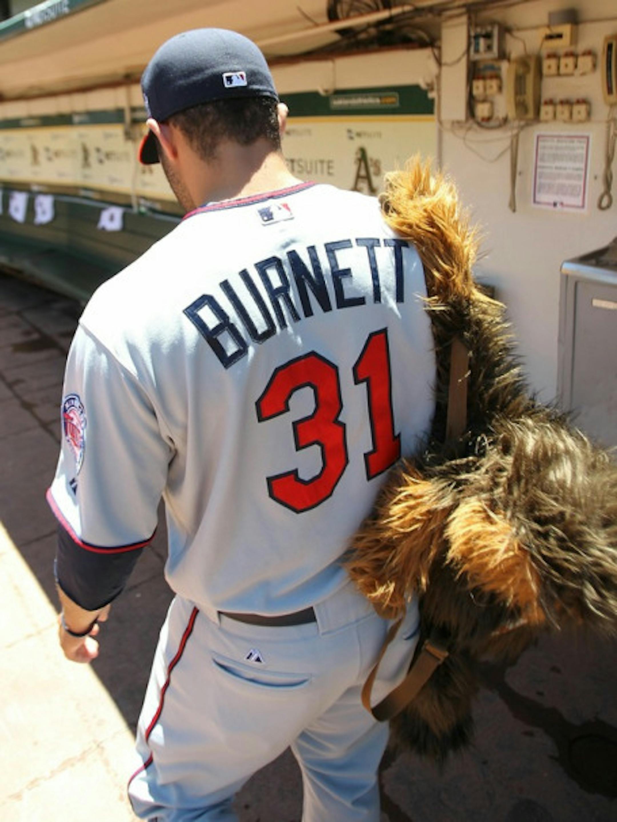 OAKLAND, CA - JUNE 06:  Alex Burnett #31 of the Minnesota Twins walks to the bullpen against the Oakland Athletics during an MLB game at the Oakland-Alameda County Coliseum on June 6, 2010 in Oakland, California.  (Photo by Jed Jacobsohn/Getty Images)