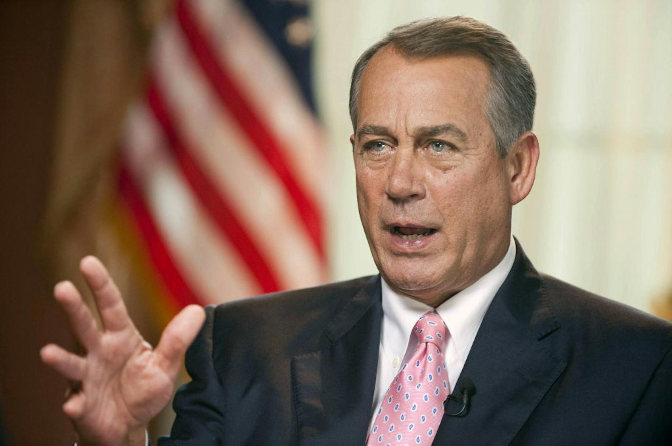 In this Friday, July 19, 2013 photo provided by CBS News, Republican Speaker of the House John Boehner, of Ohio, speaks during an interview in his Capitol Hill office for CBS's Sunday morning "Face the Nation" in Washington. Asked about how little Congress is doing these days, Boehner said Congress "ought to be judged on how many laws we repeal," not on how many laws it creates. He says the U.S. has "more laws than the administration could ever enforce," and said that view may be unpopular becau