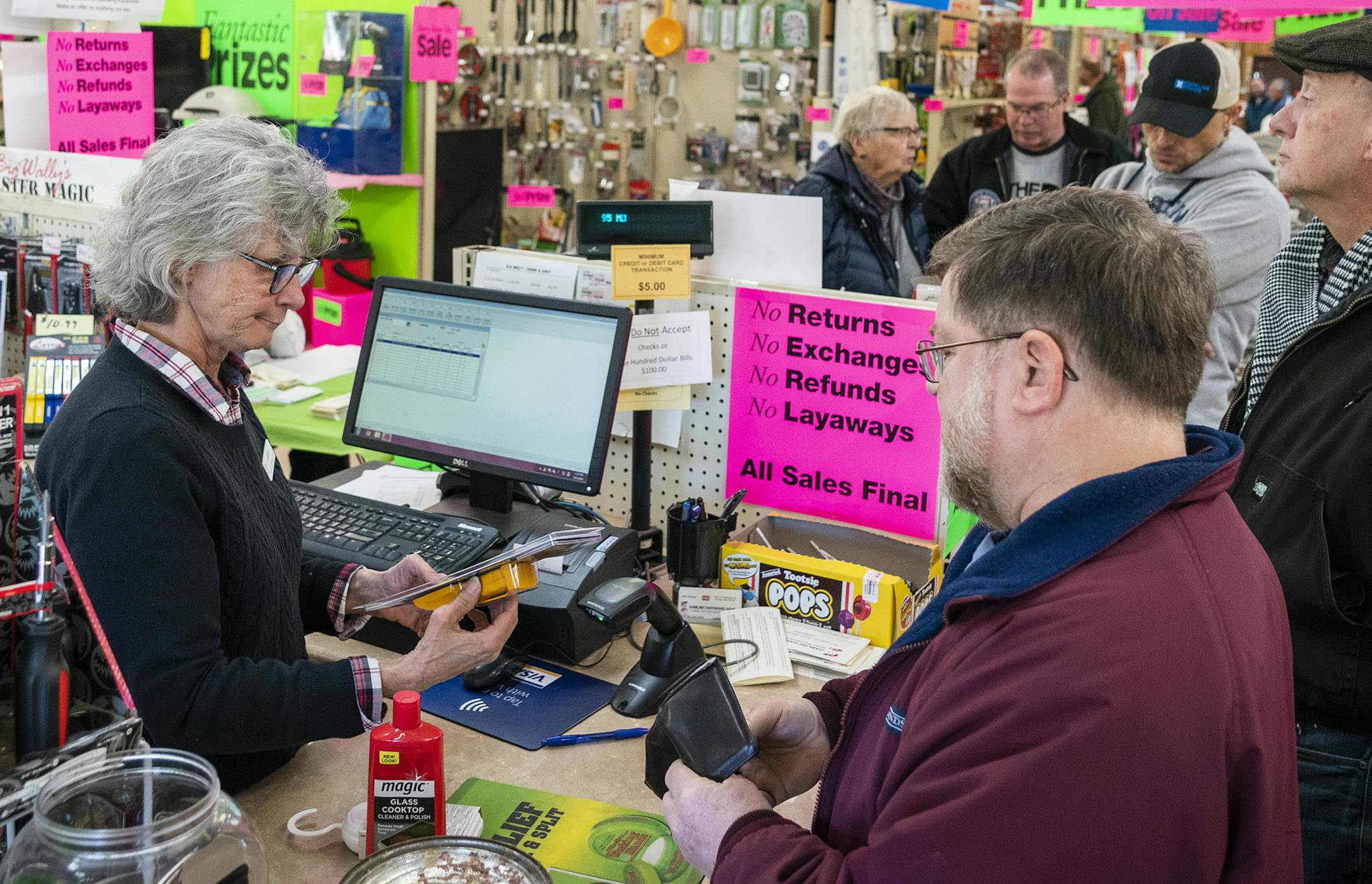 Hamline Hardware Hank co-owner Jan Gildner manned the cash register during the store-closing liquidation sale.
