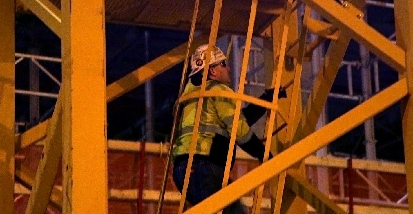 Steve Hviding climbs up 300 feet to his office at the site of the new Vikings stadium. He operates one of the five tower cranes. The worker ascends the crane in the morning and doesn&#x201a;&#xc4;&#xf4;t come down until the day&#x201a;&#xc4;&#xf4;s job is done - sometimes 10 or 12 hours later. Friday, Oct. 3, 2014. Minneapolis, Minn.