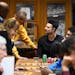 Dawson Garcia of the Gophers basketball team talks with Steve Erban of Stillwater earlier this month at a Dinkytown Athletes-hosted meet-and-greet at 