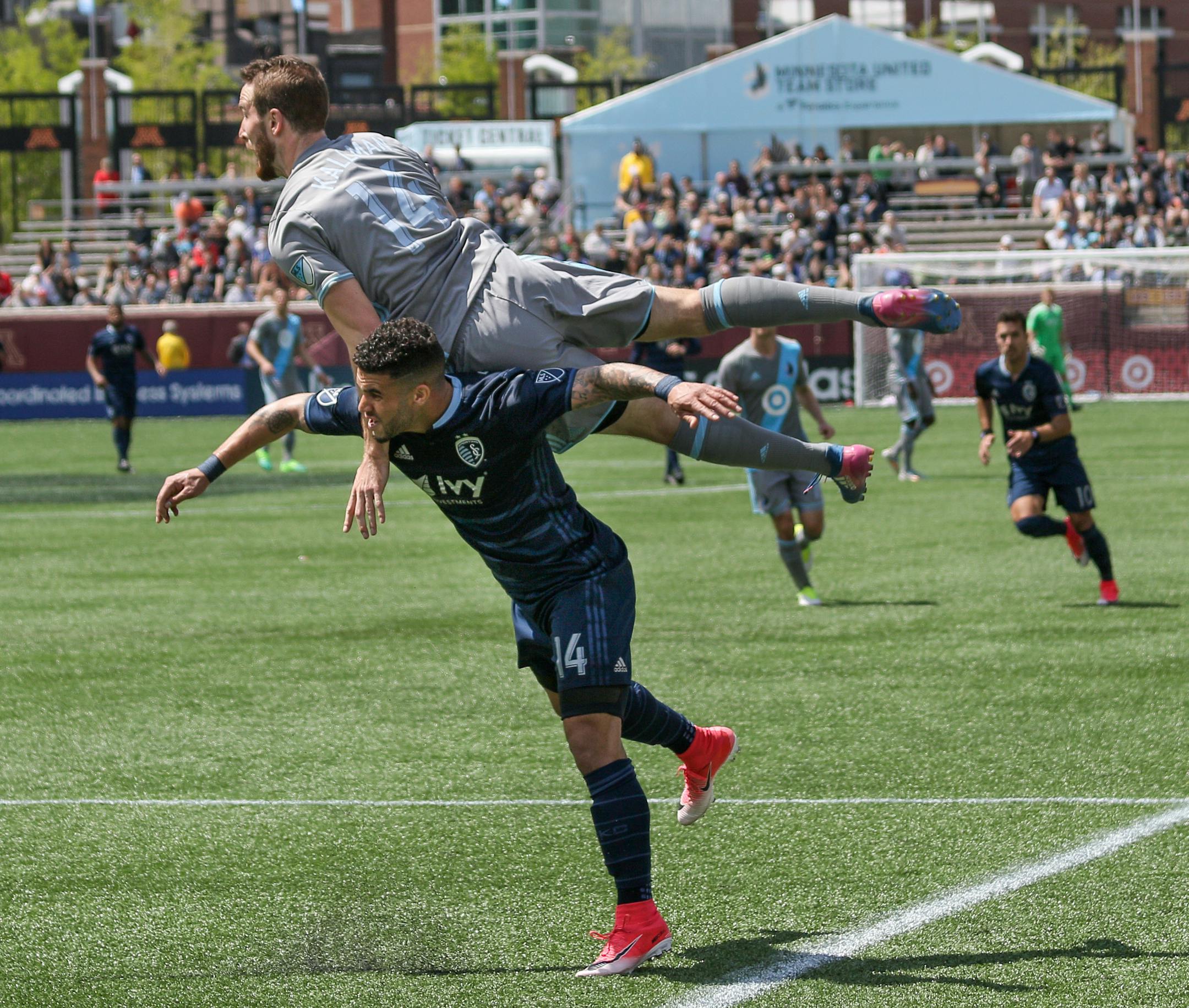 Minnesota United defender Brent Kallman jumped on Sporting Kansas City's forward Dom Dwyer.